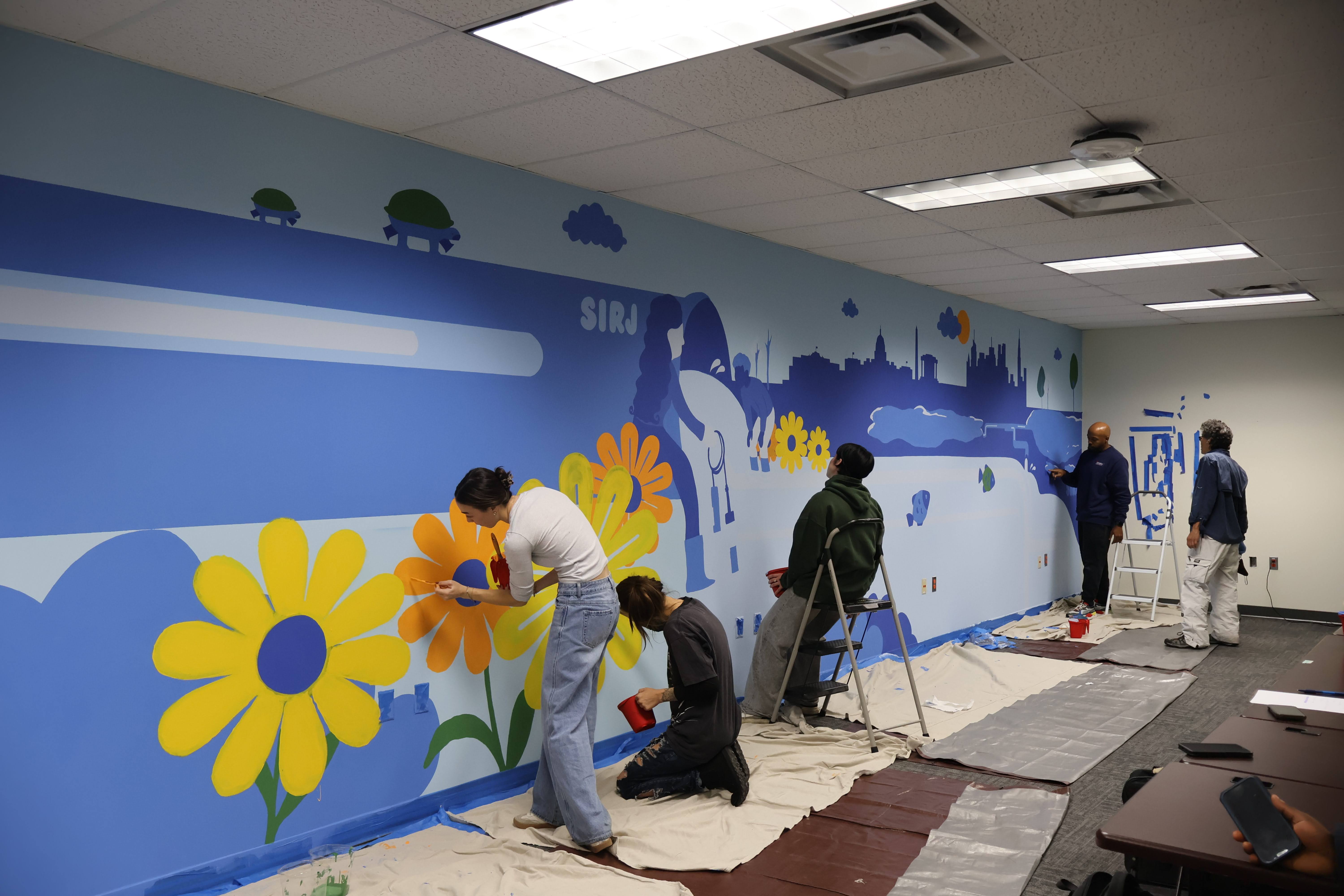 426 students in designing and painting a 46ft x 8ft mural in the SIRJ lab