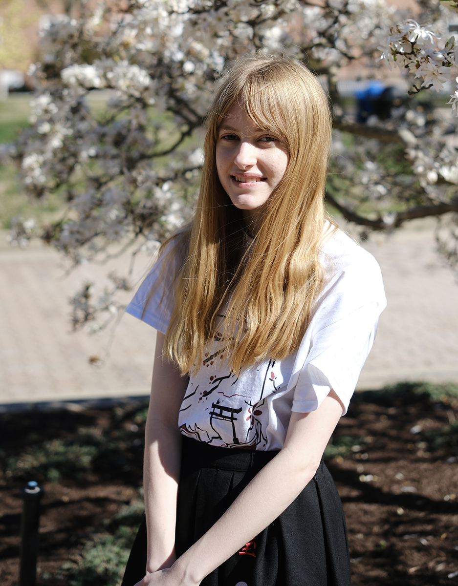 Madeleine Willette posed before cherry blossoms