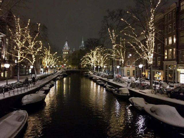 Amsterdam canal at night with a winter's coating of snow