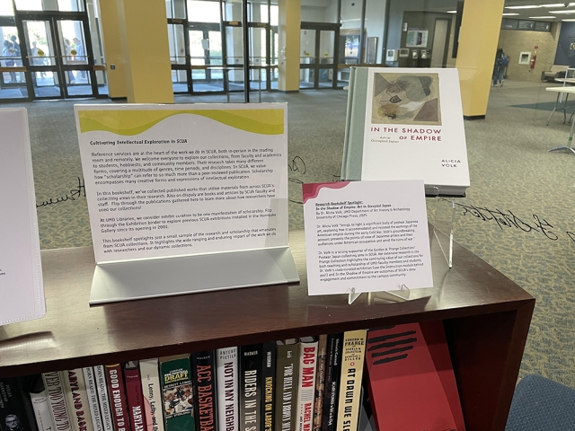 Label text and books on display in public library setting