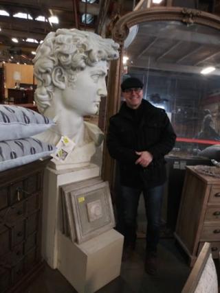 Professor Anthony Colantuono sizes up an oversized replica head of Michelangelo's David